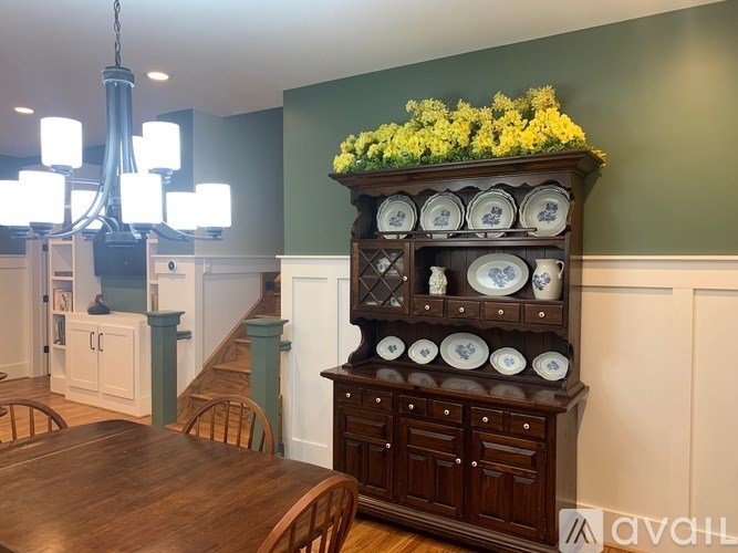 A wooden plate rack with plates on it.