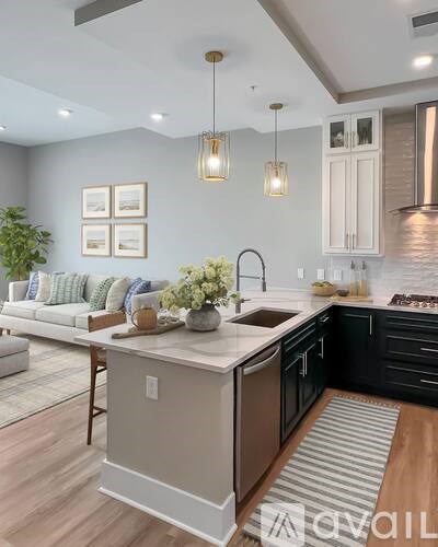 A modern kitchen with a large island in the center.