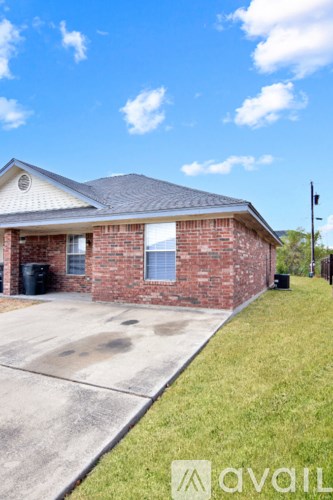 A house with a driveway in front of it.