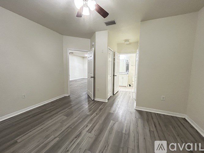 A bathroom with a sink, mirror, and lights.