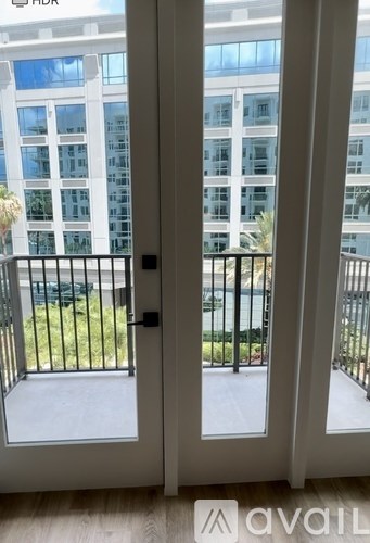 A balcony with a view of a building across the way.