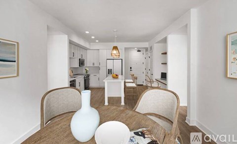 A modern living room with a dining table and chairs.