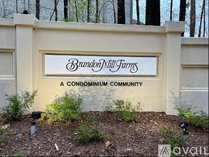 A sign that says Brandon Mill Farms in a condominium community.