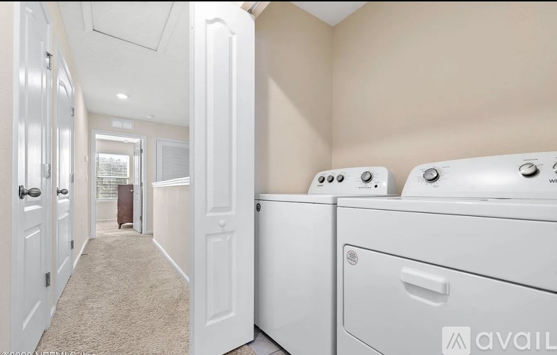 A laundry room with a washer and dryer.