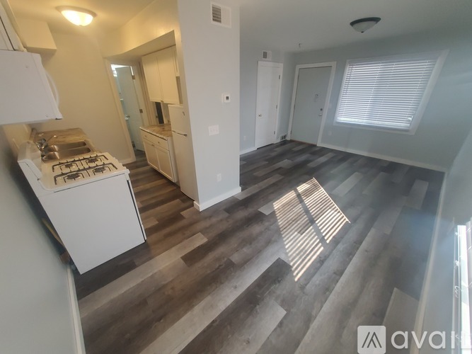 A kitchen with a stove top oven and a counter top.