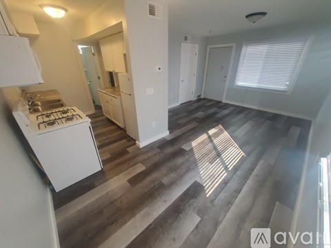 A kitchen with a stove top oven and a counter top.