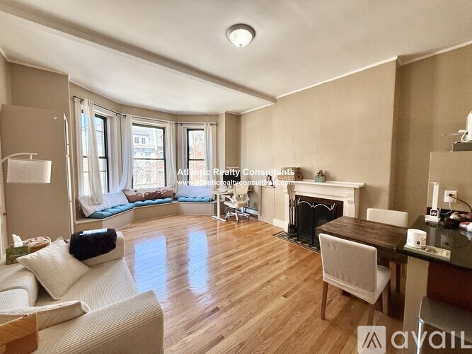 A living room with a grey couch and a coffee table.