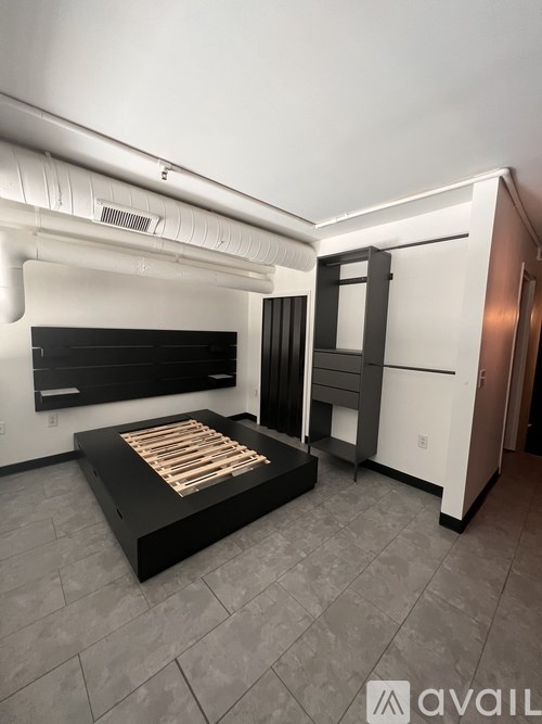 A modern kitchen with a black countertop and a built-in oven.