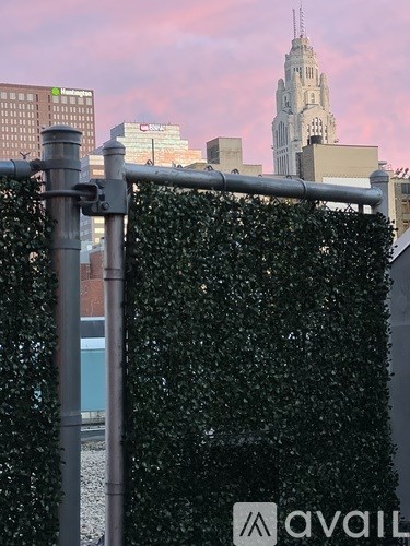 A metal fence with a sign that says "avail" on it.