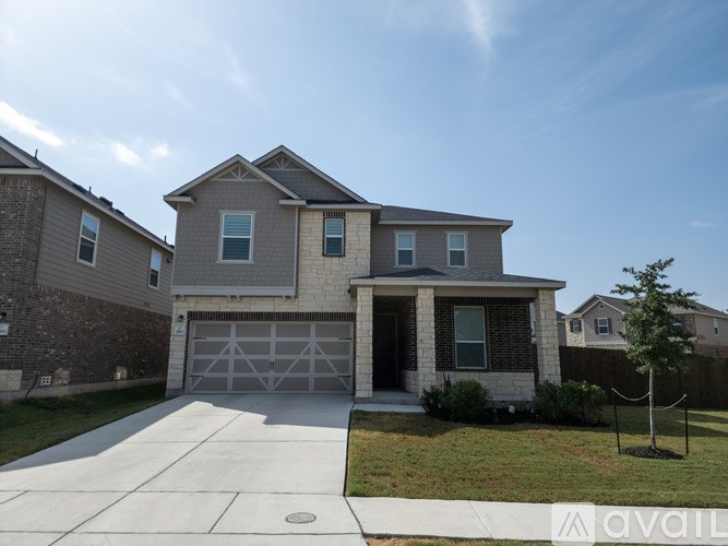 A house with a garage is for sale.