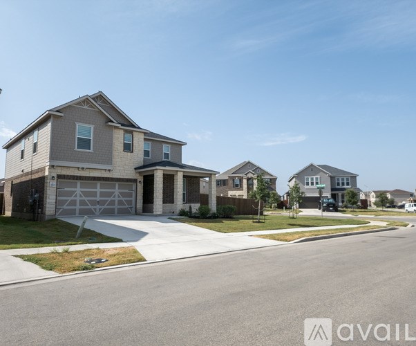 A row of houses with a clear blue sky above them.
