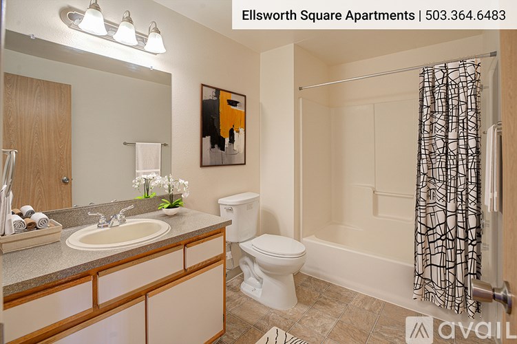 A bathroom with a toilet, sink, and shower.