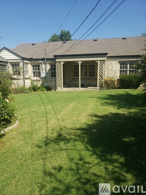 A house with a lawn in front of it.