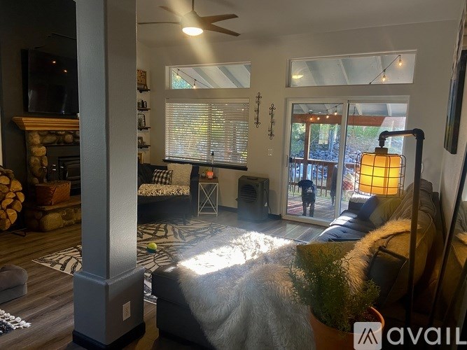 A living room with a fireplace and a couch.