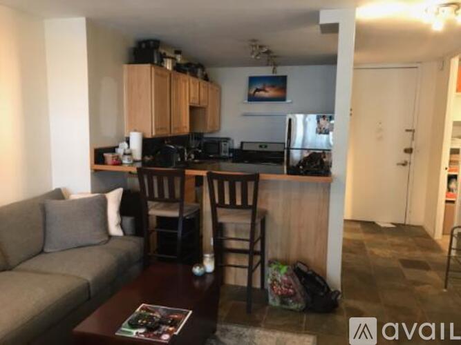 A kitchen area with a refrigerator, microwave, and oven.