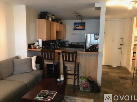 A kitchen area with a refrigerator, microwave, and oven.