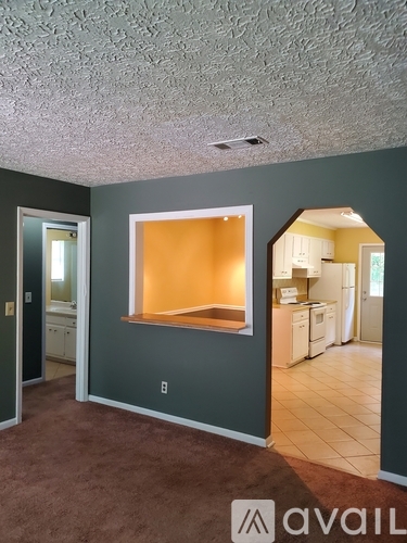 A room with a window and a door.