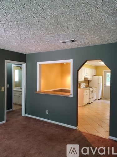 A room with a window and a door.