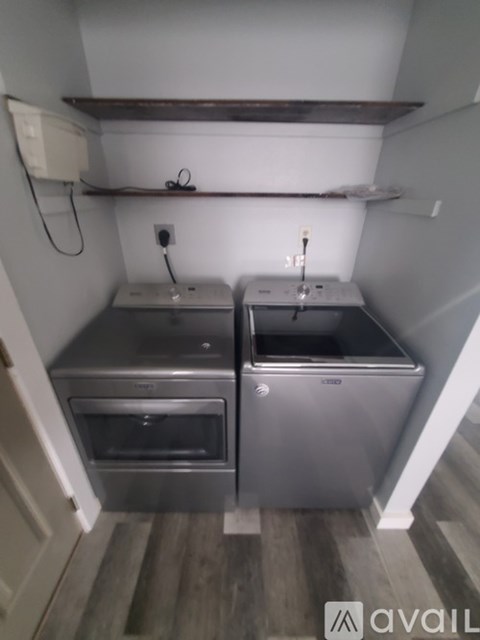 A small kitchen with a stainless steel oven and sink.