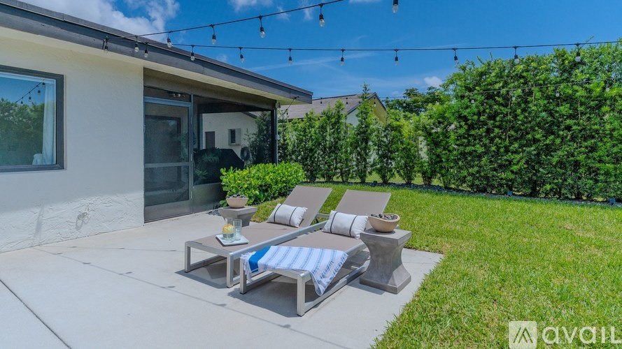 A patio with a table and chairs is available for rent.