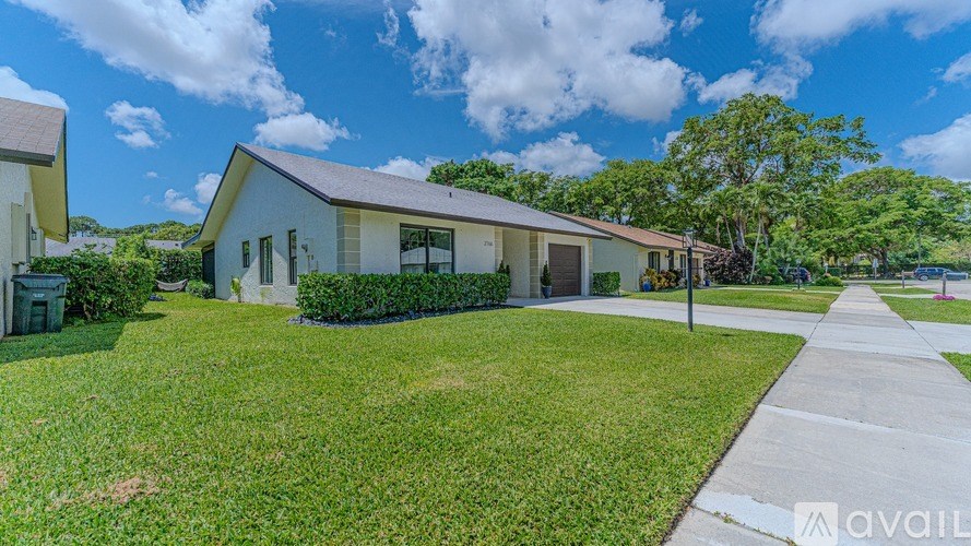 A house with a lawn in front is available for sale.