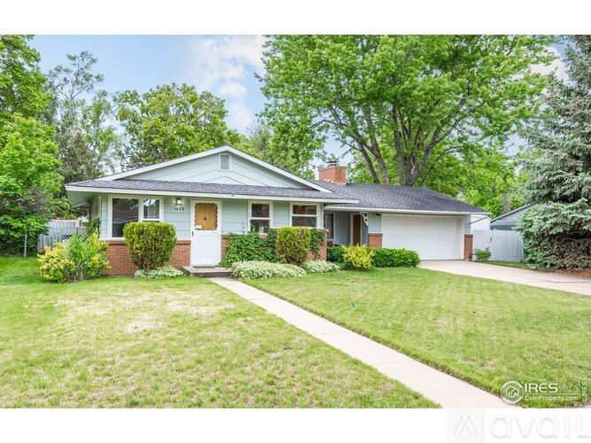 A house with a white front door and a small porch.