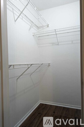 Empty refrigerator with shelves and racks.