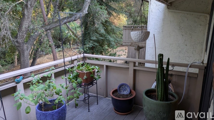 A living room with a couch, lamp, and a painting.