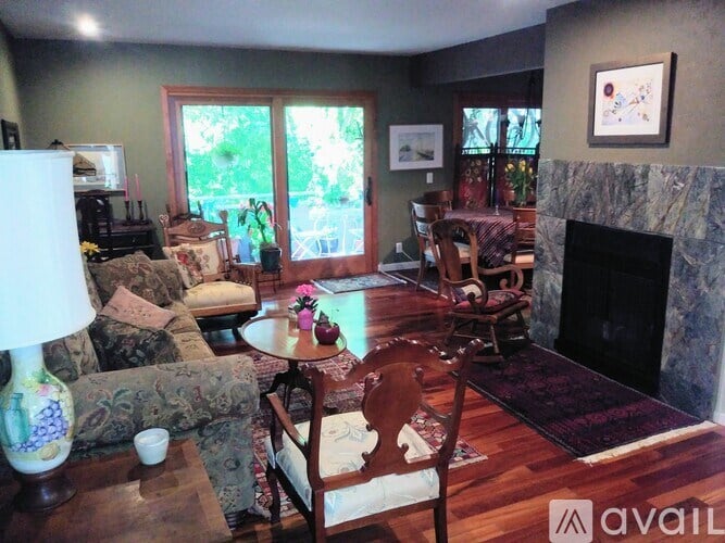 A living room with a fireplace and a couch.