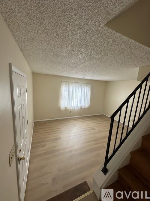 A room with a staircase leading to the second floor.