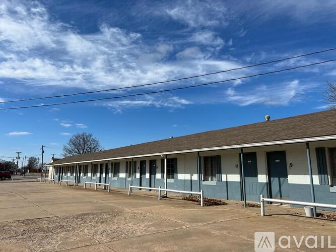 A row of houses with blue doors and windows.
