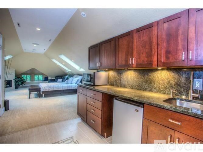 A kitchen with wooden cabinets and a dishwasher.