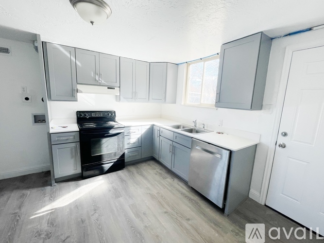 A kitchen with a black oven and stove top.