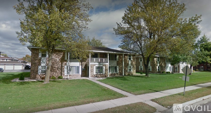 A house with a tree in front of it.