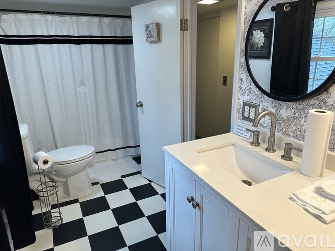 A black and white checkered bathroom floor.