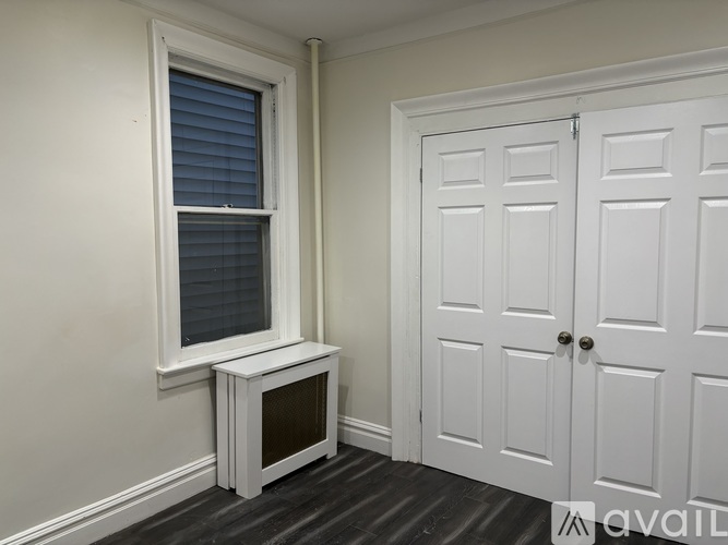 A white door with a window above it.