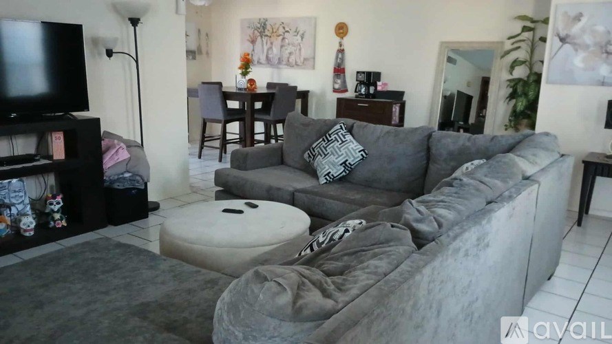 A kitchen with a sink, dishwasher, and stove.