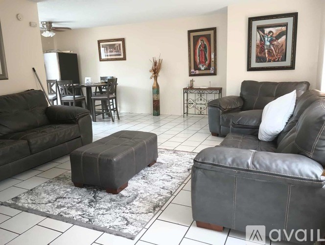 A kitchen with granite countertops and white appliances.
