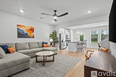 A living room with a grey sofa and a coffee table.