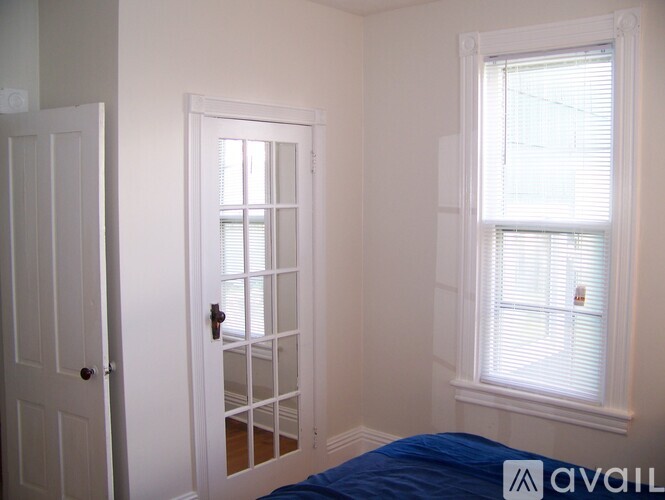 A room with a door and a window.