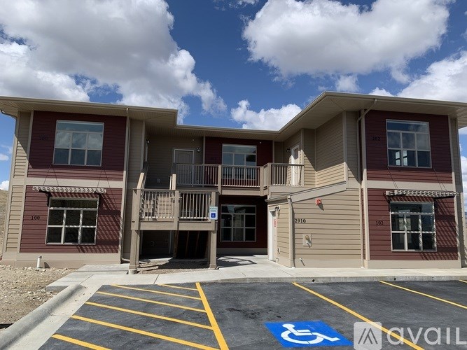 A building with a parking space in front of it.