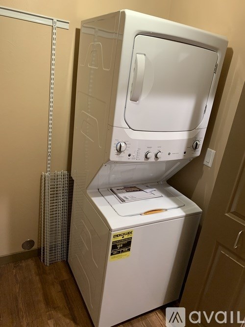 A white dryer and washer combo unit is available for rent.
