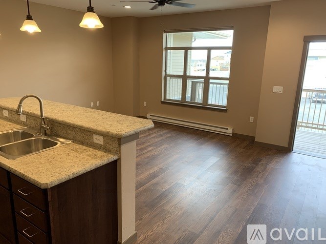A kitchen with a sink and a window.