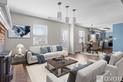 A living room with a white couch and a coffee table.