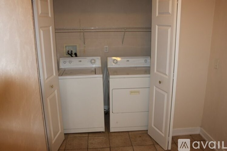 A laundry room with a washer and dryer.
