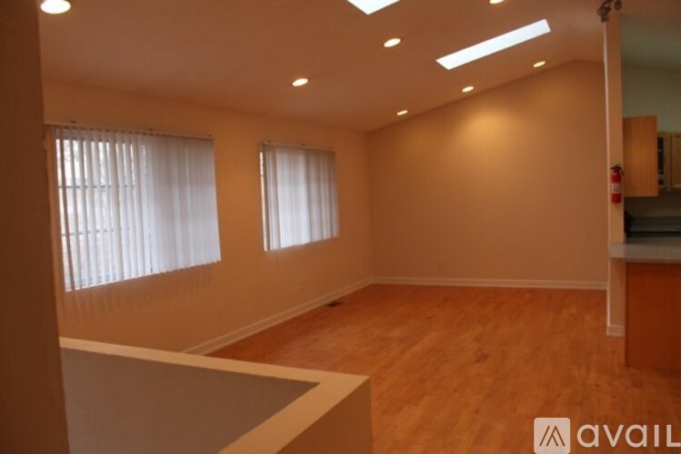 A room with wooden floors and a white counter.