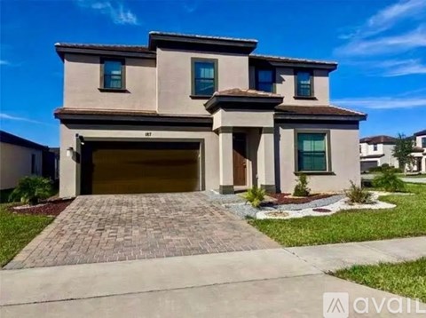 A house with a garage is for sale.