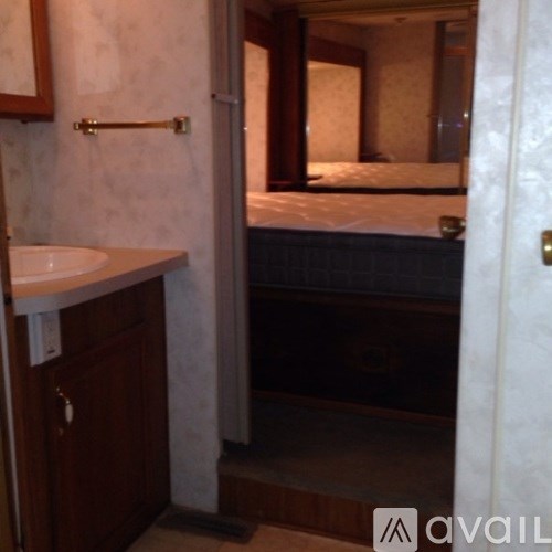 A bathroom with a sink and mirror.