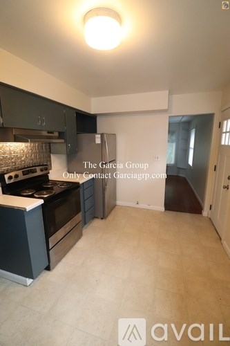 A kitchen with a stove top oven and a counter top.