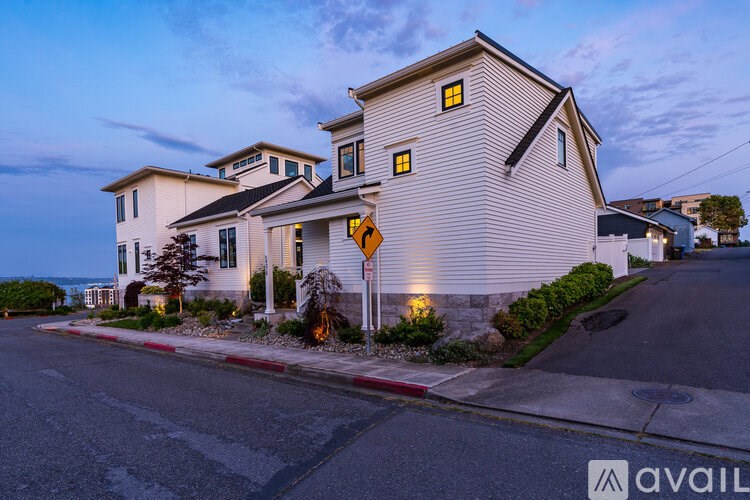 A house with a street sign in front of it.